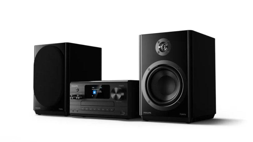 Micro chaîne hi-fi Philips Fidelio FA7 avec unité centrale à écran numérique, lecteur CD motorisé et deux enceintes noires avec tweeter en titane.
